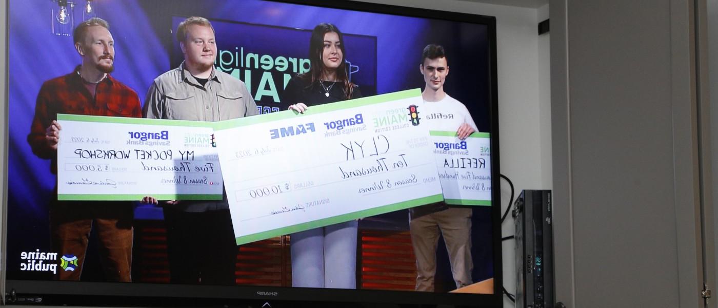 Anderson is shown on the television holding the winning, $10,000 check. Her competitors are pictured with 2nd and 3rd-place checks.